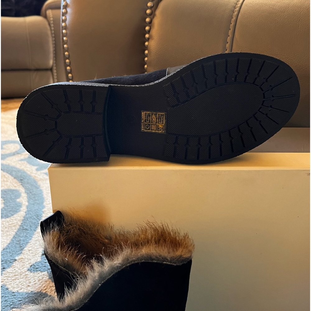 Black leather boots with rabbit fur like inside. Never worn except to try on